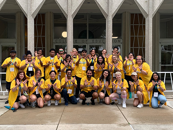 Group of tour guides in front of the college of education building